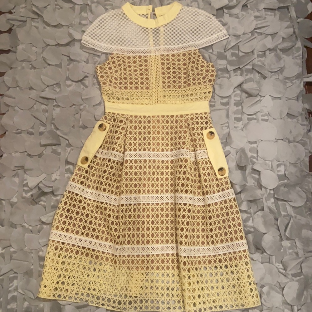 Brand new light yellow and white lace overlay with white lace cape sleeve.